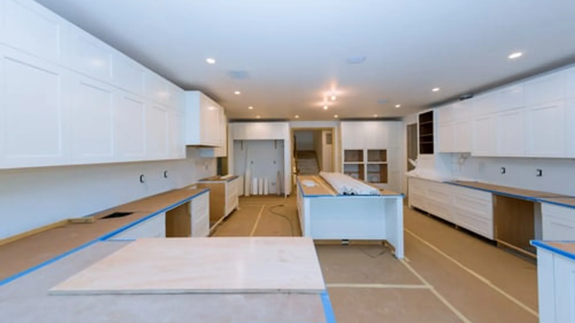 Bright kitchen mid-renovation with new cabinetry being installed